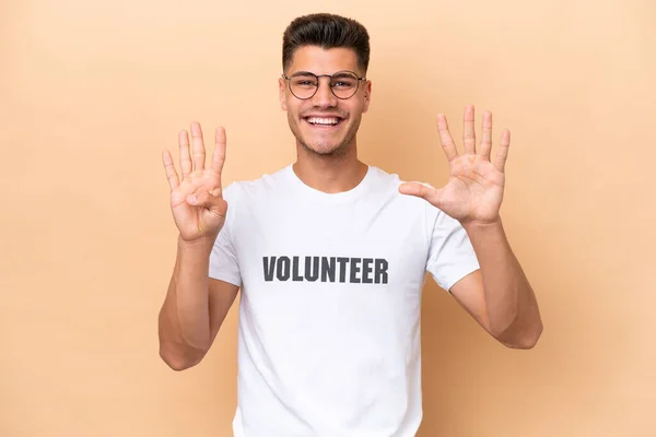 Young Volunteer Caucasian Man Isolated Beige Background Counting Nine Fingers — Stock Photo, Image