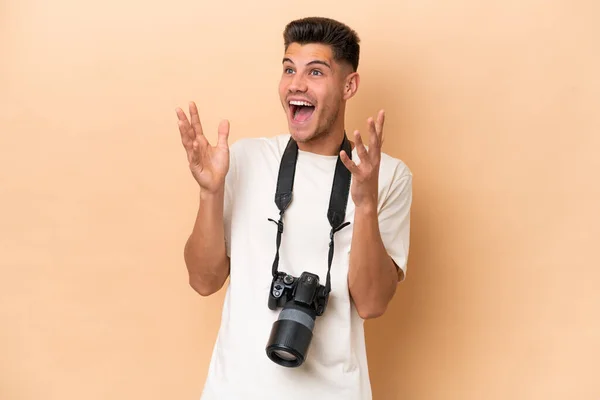 Young Photographer Caucasian Man Isolated Beige Background Surprise Facial Expression — Stock Photo, Image