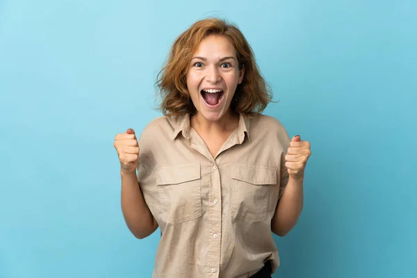 Young Georgian Woman Isolated Blue Background Celebrating Victory Winner Position — Stock Photo, Image