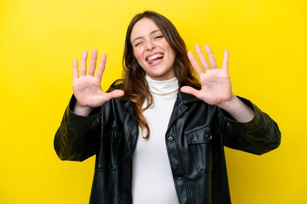 stock image Young caucasian woman isolated on yellow background counting ten with fingers