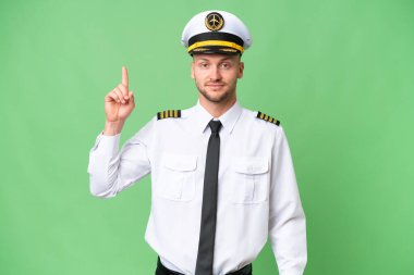 İzole edilmiş arka planda uçak pilotu işaret parmağı harika bir fikir.