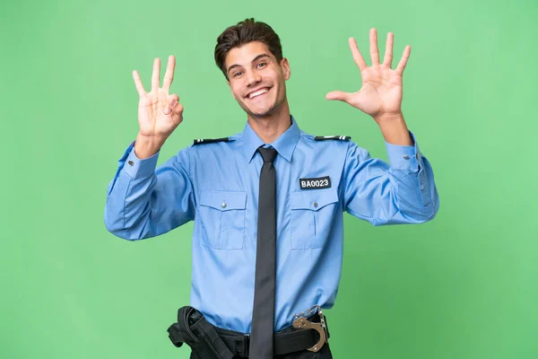 Jovem Policial Sobre Fundo Isolado Contando Oito Com Dedos — Fotografia de Stock