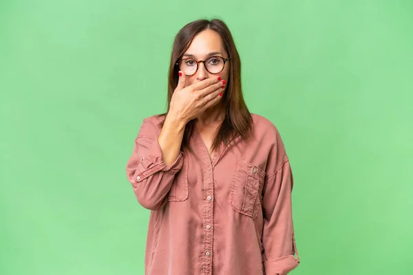 stock image Middle-aged caucasian woman over isolated background covering mouth with hand