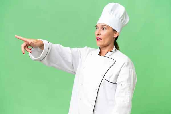 Middle Aged Chef Woman Isolated Background Pointing Away — Stock Photo, Image