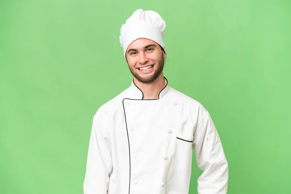 Młody Przystojny Szef Kuchni Człowiek Odizolowane Tło Śmiech — Zdjęcie stockowe