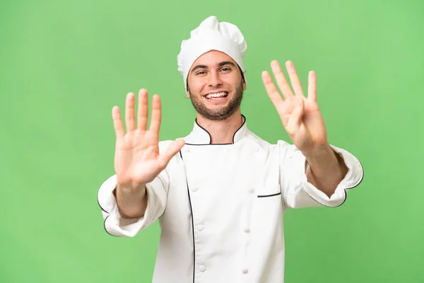 Jonge Knappe Chef Kok Geïsoleerde Achtergrond Tellen Negen Met Vingers — Stockfoto