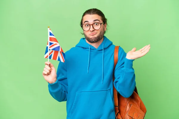 Mladý Pohledný Muž Držící Britskou Vlajku Nad Izolovaným Pozadím Který — Stock fotografie