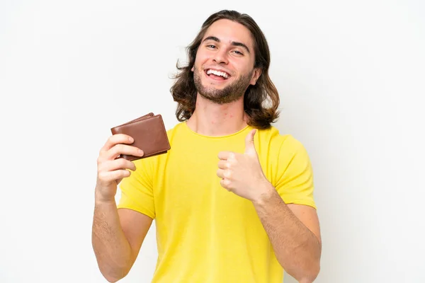 Mladý Pohledný Muž Drží Peněženku Izolovanou Bílém Pozadí Palci Nahoru — Stock fotografie