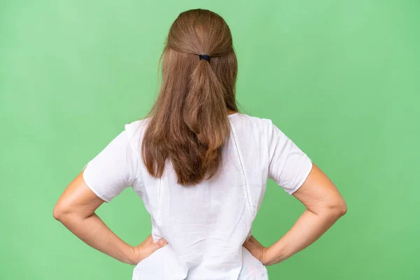背部位置の隔離された背景の上に中年の白人女性 — ストック写真