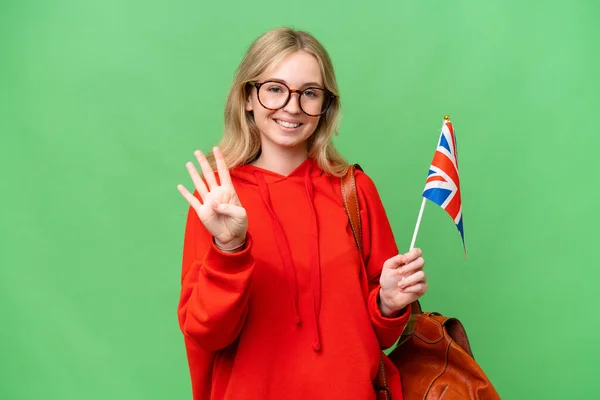 年轻的惊慌失措的女人高高兴兴地举着英国国旗 手指头数着四只 — 图库照片