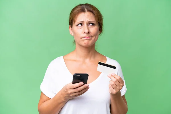 Middle Aged Caucasian Woman Isolated Background Buying Mobile Credit Card Stock Picture