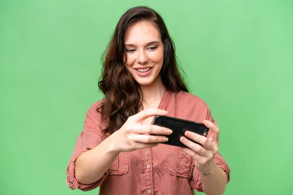 Young Caucasian Woman Isolated Background Playing Mobile Phone — Stock Fotó