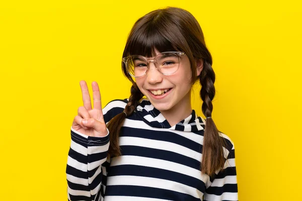 Little Caucasian Girl Isolated Yellow Background Glasses Doing Sign — Stockfoto