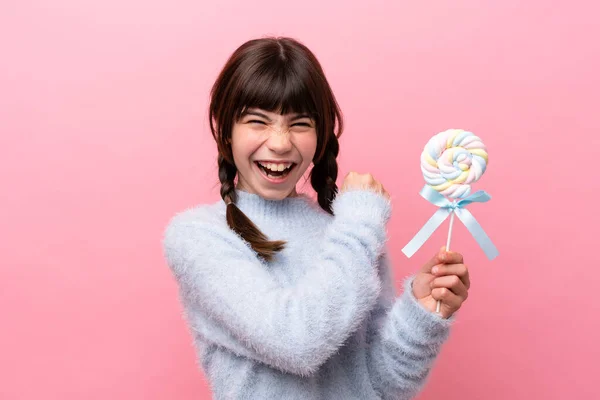 Little Caucasian Girl Holding Lollipop Celebrating Victory — Stockfoto