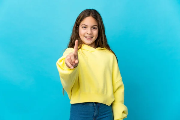 Menina Sobre Fundo Azul Isolado Mostrando Levantando Dedo — Fotografia de Stock