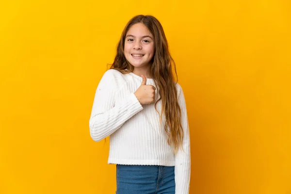 Child Isolated Yellow Background Giving Thumbs Gesture — стоковое фото