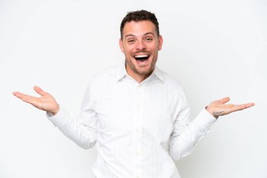 Young caucasian handsome man isolated on white background with shocked facial expression