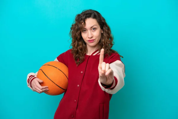 Young Caucasian Basketball Player Woman Isolated Blue Background Showing Lifting — Stock fotografie