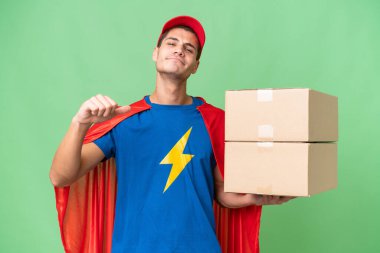 Super Hero delivery man over isolated background proud and self-satisfied