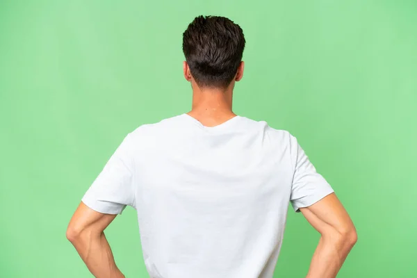 Joven Caucásico Guapo Hombre Sobre Aislado Fondo Espalda Posición —  Fotos de Stock