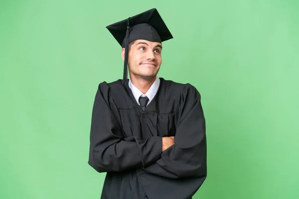 Young University Graduate Caucasian Man Isolated Background Making Doubts Gesture — Stock Photo, Image