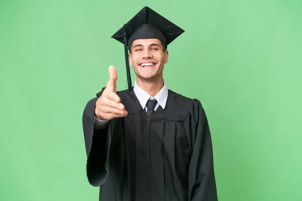 Jovem Universidade Pós Graduação Caucasiano Homem Sobre Isolado Fundo Apertando — Fotografia de Stock