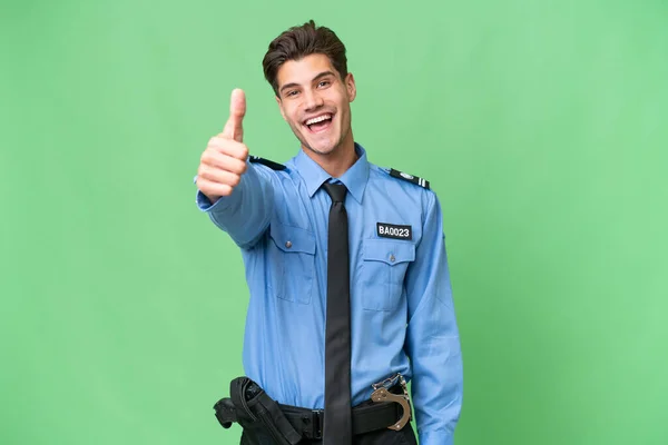 Młody Policjant Odizolowanym Tle Kciukami Górze Stało Się Coś Dobrego — Zdjęcie stockowe