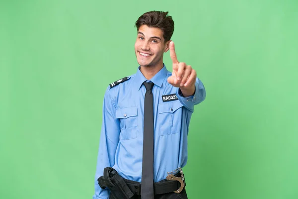 Jonge Politieman Geïsoleerde Achtergrond Tonen Heffen Van Een Vinger — Stockfoto