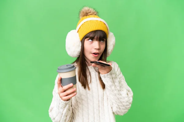 Little Caucasian Girl Wearing Winter Muffs Isolated Background Holding Coffee — Stock Photo, Image