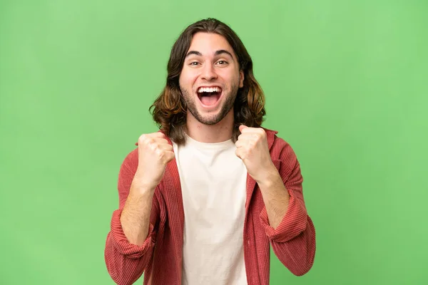 stock image Young handsome man over isolated background celebrating a victory in winner position