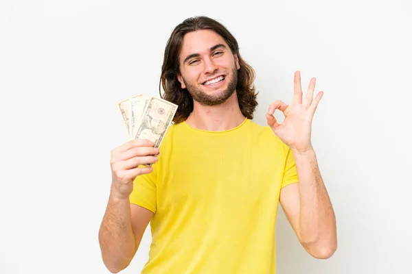 Jovem Bonito Homem Tomando Monte Dinheiro Isolado Fundo Branco Mostrando — Fotografia de Stock