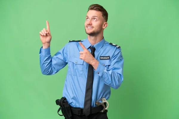 Jovem Policial Sobre Fundo Isolado Apontando Com Dedo Indicador Uma — Fotografia de Stock
