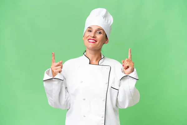 Middle Aged Chef Woman Isolated Background Pointing Great Idea — Stock Photo, Image