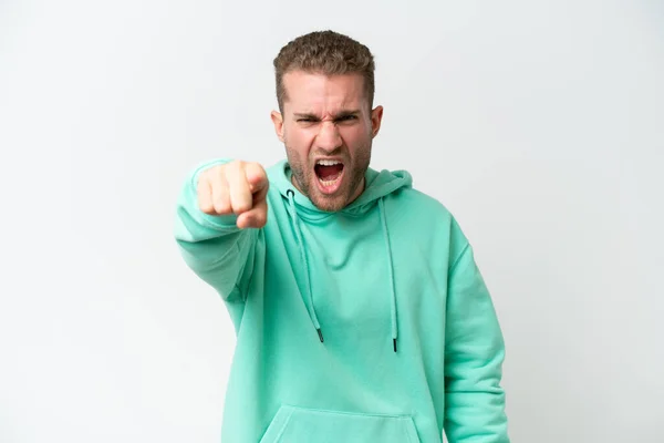 stock image Young handsome caucasian man isolated on white background frustrated and pointing to the front