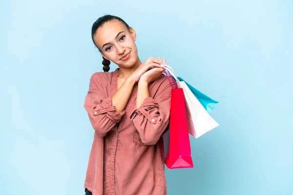 Young Arab Woman Isolated Blue Background Holding Shopping Bags — Stock Photo, Image