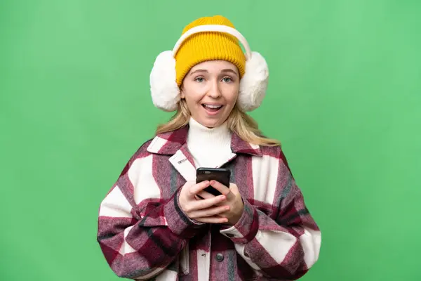 Young English Woman Wearing Winter Muffs Isolated Background Surprised Sending — Stock Fotó