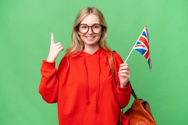 Young hispanic woman holding an United Kingdom flag over isolated background pointing up a great idea