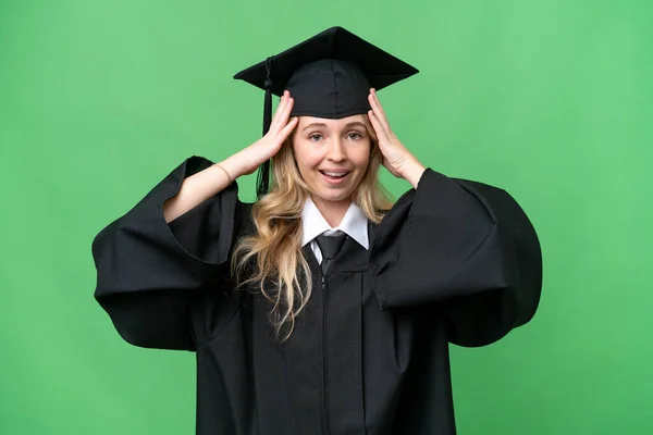 Young university English graduate woman over isolated background with surprise expression