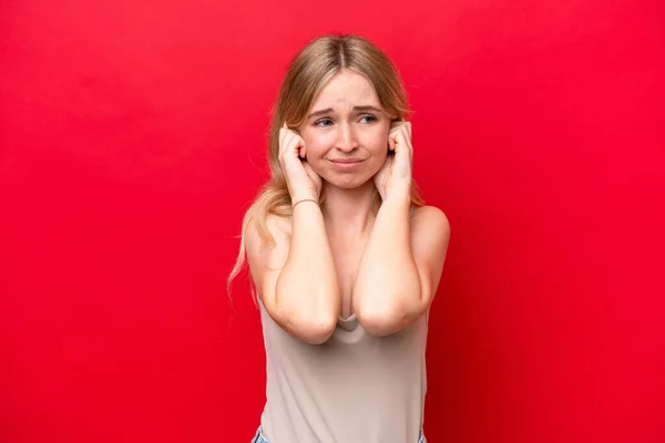 Young English Woman Isolated Red Background Frustrated Covering Ears — стоковое фото