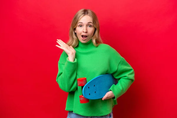 Young English Woman Isolated Red Background Skate Doing Surprise Gesture — Stock Photo, Image