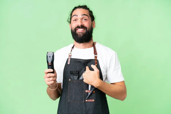 stock image Young barber man over isolated chroma key background with surprise facial expression