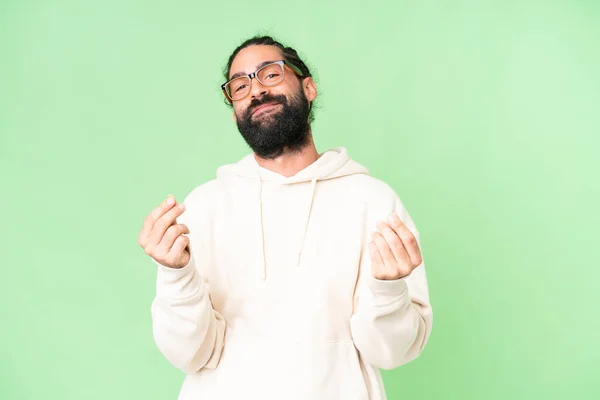 Stock image Young man with beard over isolated chroma key background making money gesture