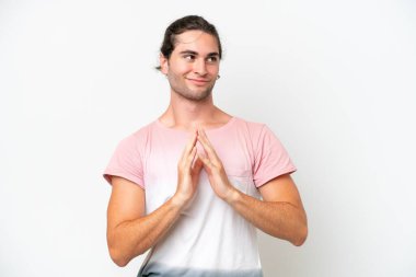 Caucasian handsome man isolated on white background scheming something
