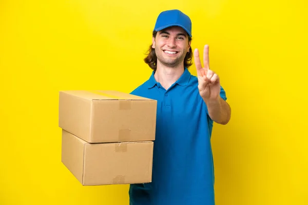 Delivery Handsome Man Isolated Yellow Background Smiling Showing Victory Sign — Stock Photo, Image