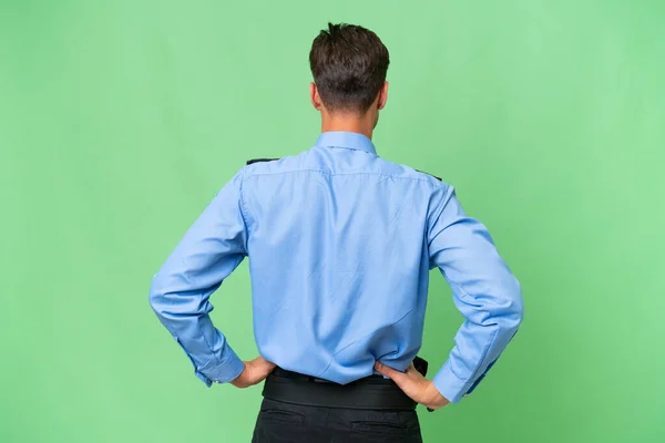 Junger Polizist Mit Isoliertem Hintergrund Rückenlage — Stockfoto