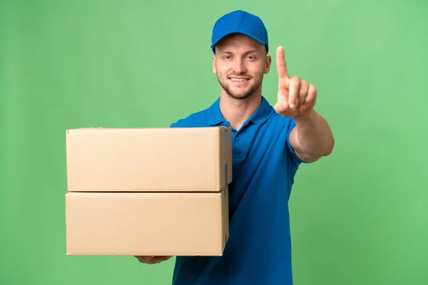 Delivery Caucasian Man Isolated Background Showing Lifting Finger — Stock Photo, Image