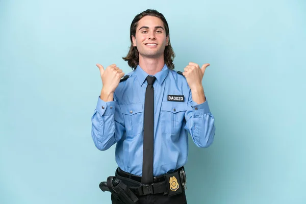Young Police Caucasian Man Isolated Blue Background Thumbs Gesture Smiling — Stock Photo, Image
