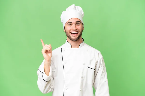 Junger Gutaussehender Koch Mit Isoliertem Hintergrund Der Eine Idee Denkt — Stockfoto