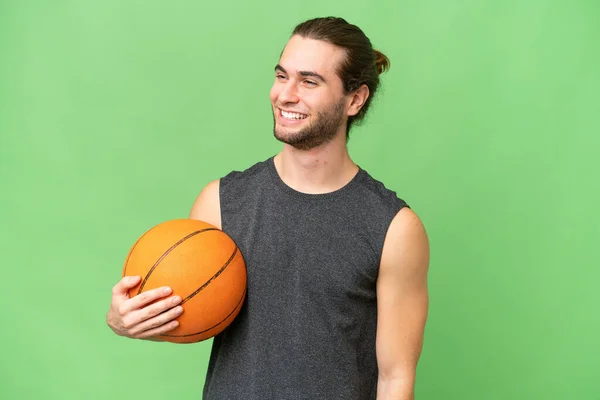 stock image Young basketball player man over isolated background looking to the side and smiling