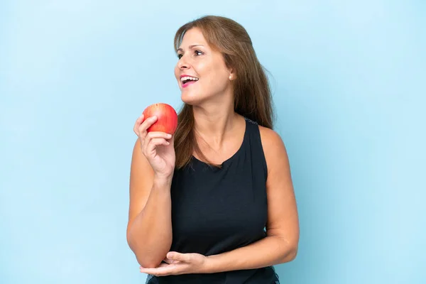 Middle Aged Caucasian Woman Isolated Blue Background Apple Happy — Photo